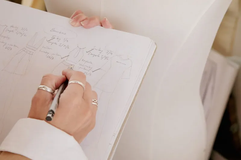 Sketching a garment design by hand, the way it's taught in the diploma course